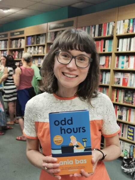 Ania Bas (c) Laura Lawrence Author Ania Bas holds a copy of her debut novel, Odd Hours