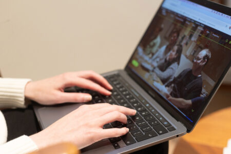 An-Introduction-to-Writing-a-Novel-1 Hands typing with Faber Academy site on screen